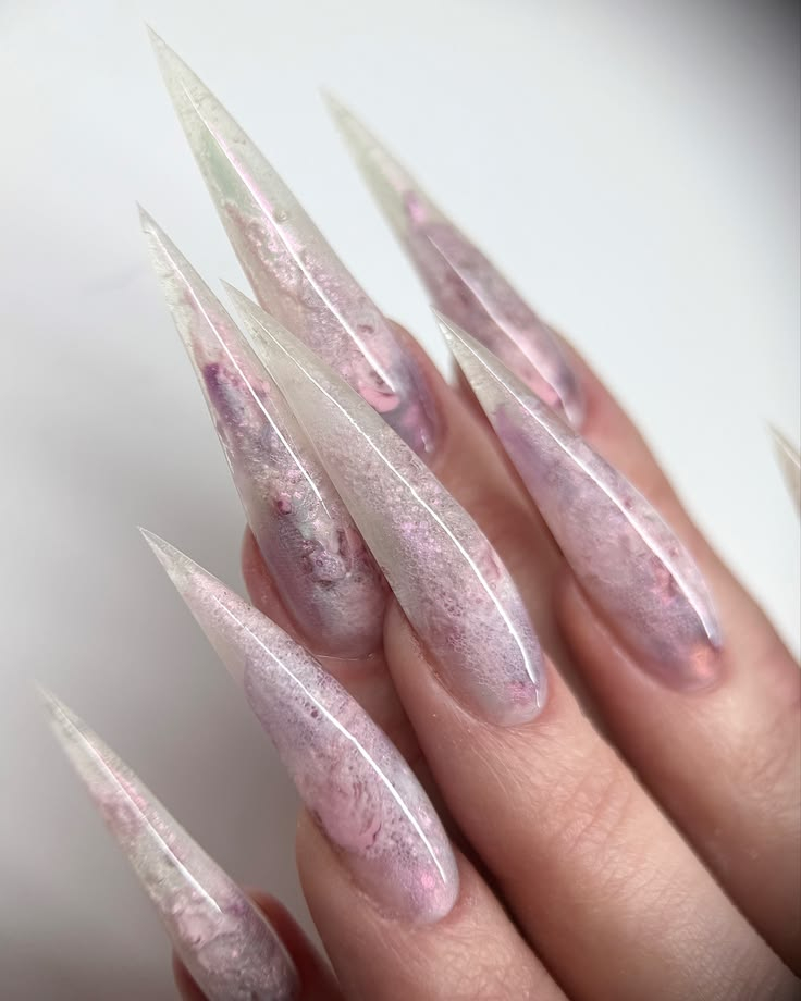 Ethereal translucent pink quartz stiletto nails with subtle shimmer and frosted tips