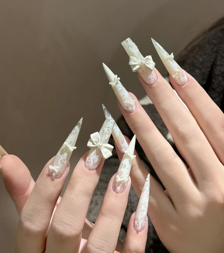 Exquisite bridal nail services Etobicoke featuring delicate white lace patterns and 3D bow accents