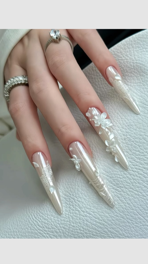 Glazed pearl bridal nails with sculpted 3D white flowers and lace details